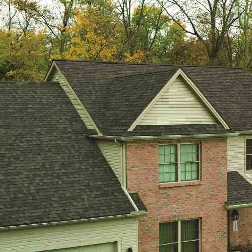 OOwens Corning Oakridge® Driftwood_ residential roofing_lady on the roof