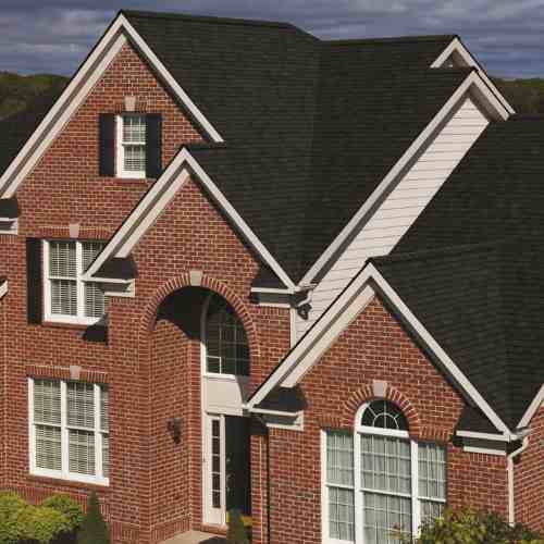Owens Corning TruDefinition® Duration STORM® Onyx Black_ residential roofing_lady on the roof