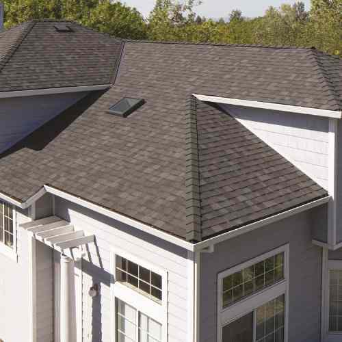 Owens Corning TruDefinition® Duration® COOL Mountainside_ residential roofing_lady on the roof
