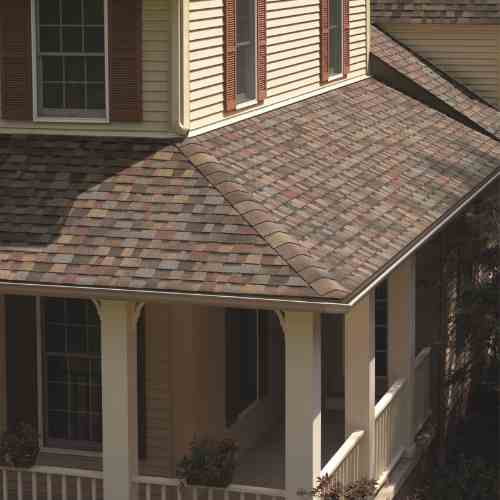 Owens Corning TruDefinition® Duration® Designer Summer Harvest_ residential roofing_lady on the roof