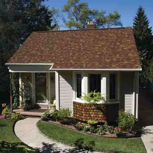 Owens Corning TruDefinition® Duration® Shingles Desert Rose _ redidential roofing_lady on the roof