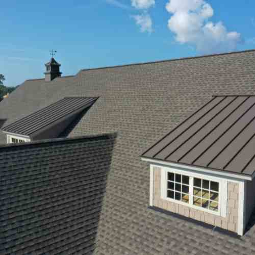 commercial roofing_lady on the roof